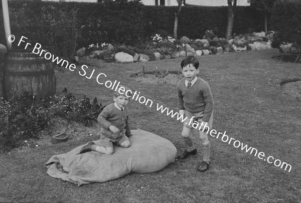 JOHN MALLICK PLAYING WITH HIS COUSINS O'NEILL & MRS O'NEILL AT MALLICKS ON CURRAGH